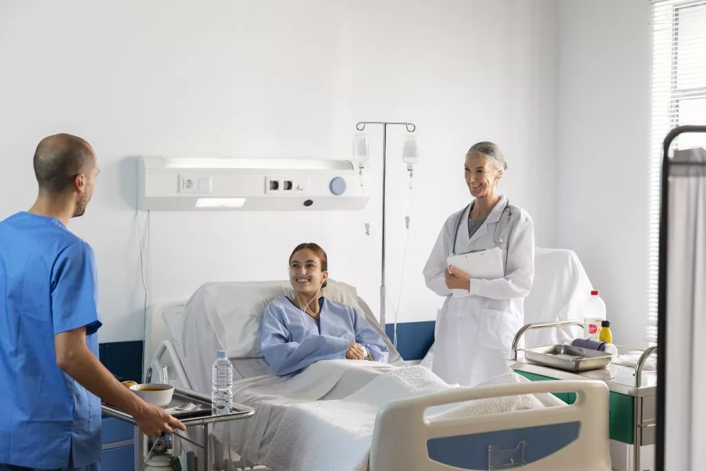 medium-shot-doctor-and-nurse-with-patient.jpg